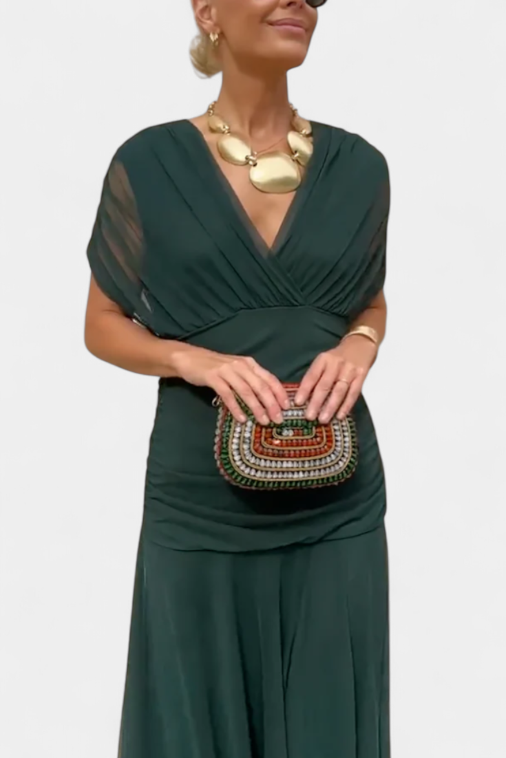 Forest green maxi dress with ruched waist and flowing skirt, front view detail