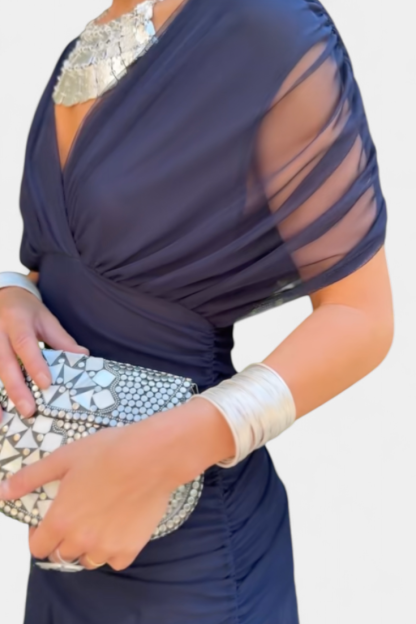 Navy blue ruched maxi dress with sheer wrap overlay and side ruching detail