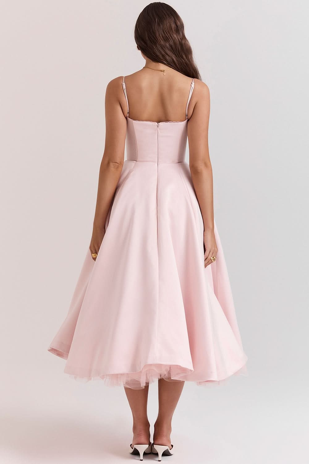 Light pink corset midi dress back view with fitted bodice and full skirt
