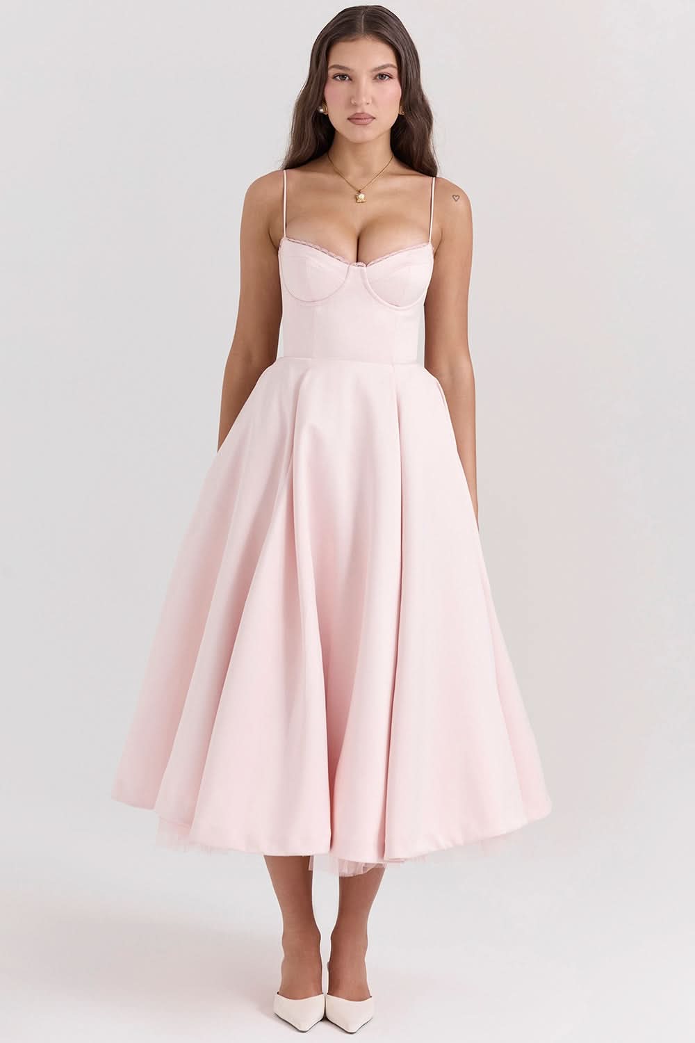 Soft pink corset midi dress with structured bust and voluminous skirt