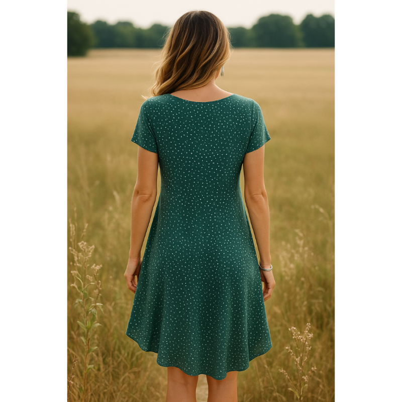 Back view of green polka dot mini dress with A-line silhouette and short sleeves for women