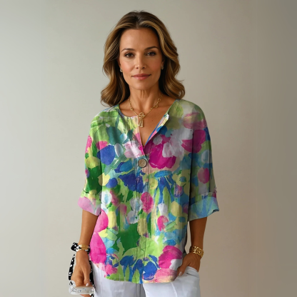 Bright watercolor floral 3/4 sleeve top in lime green, pink, blue and yellow tones