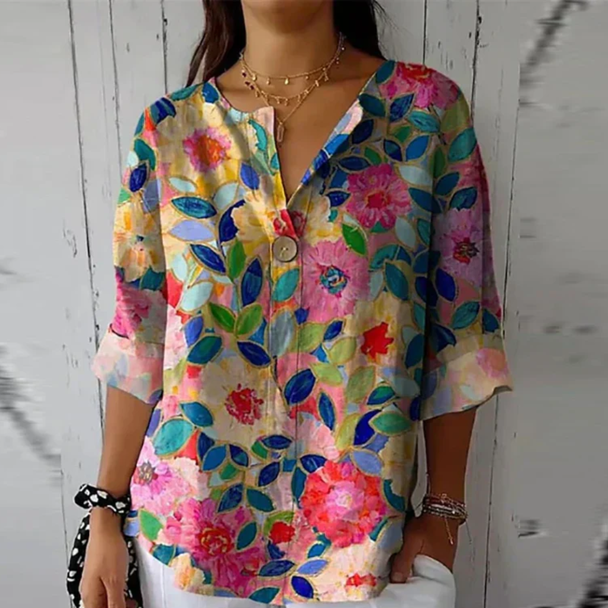 Close-up detail of multicolor floral print 3/4 top with layered leaves and blooms