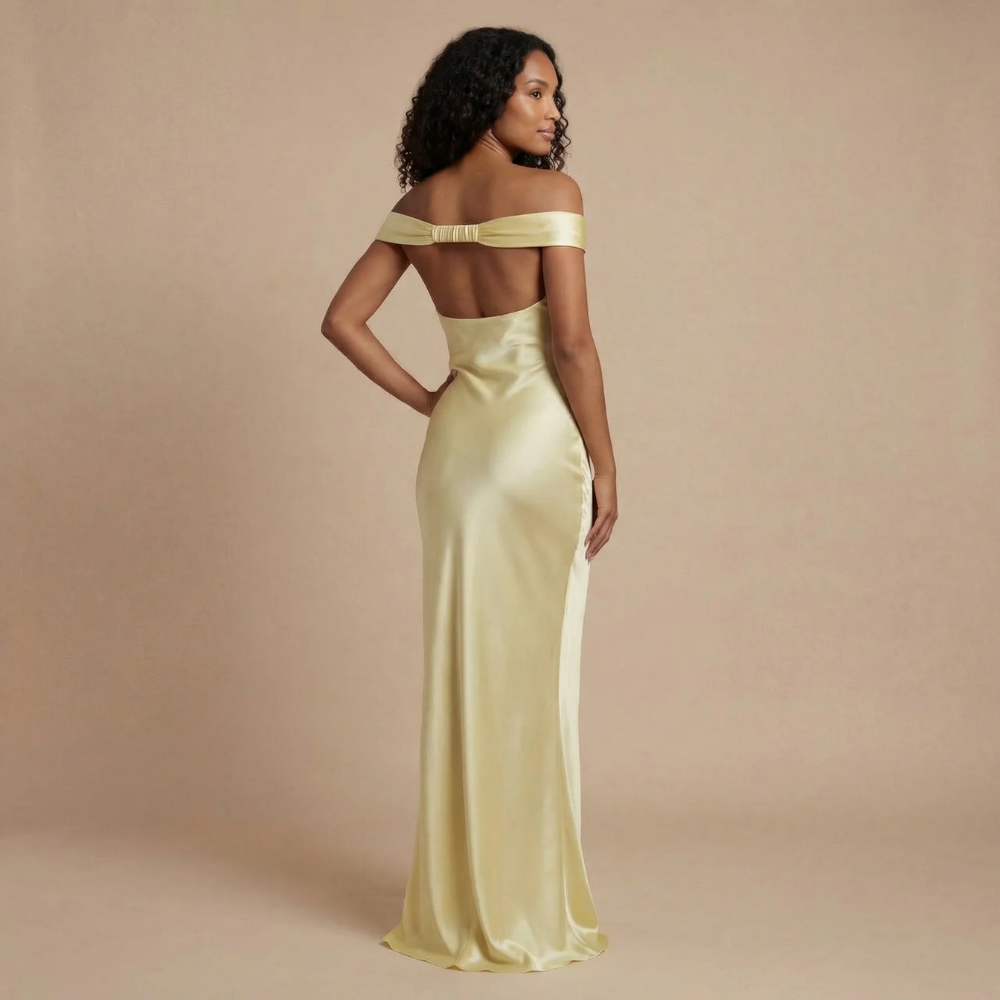 Back view of pale yellow off-shoulder maxi dress showing backless design