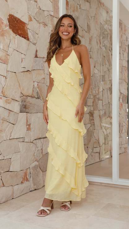 Yellow halter ruffled maxi dress with layered cascade ruffle detail
