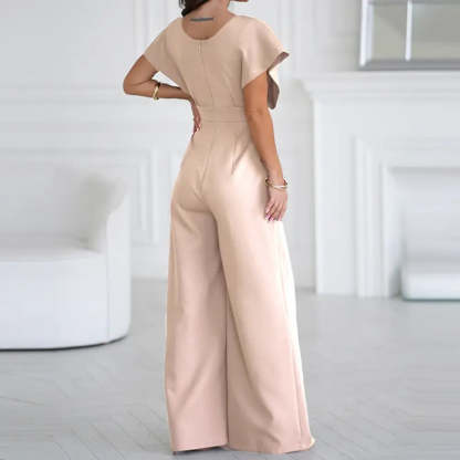 Blush pink wrap jumpsuit back view with short puffed sleeves