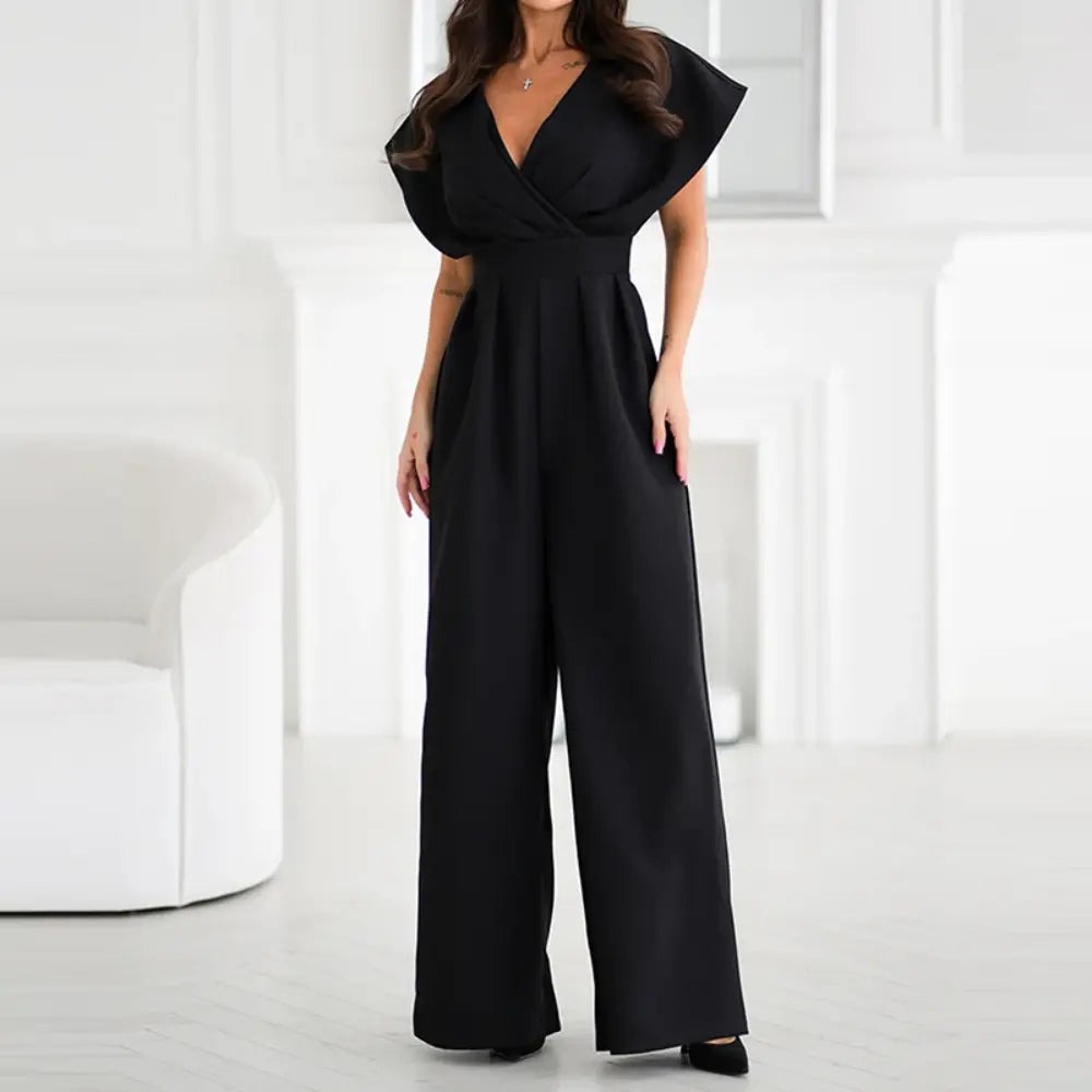 Black wrap jumpsuit front view with V-neckline and flowing wide legs