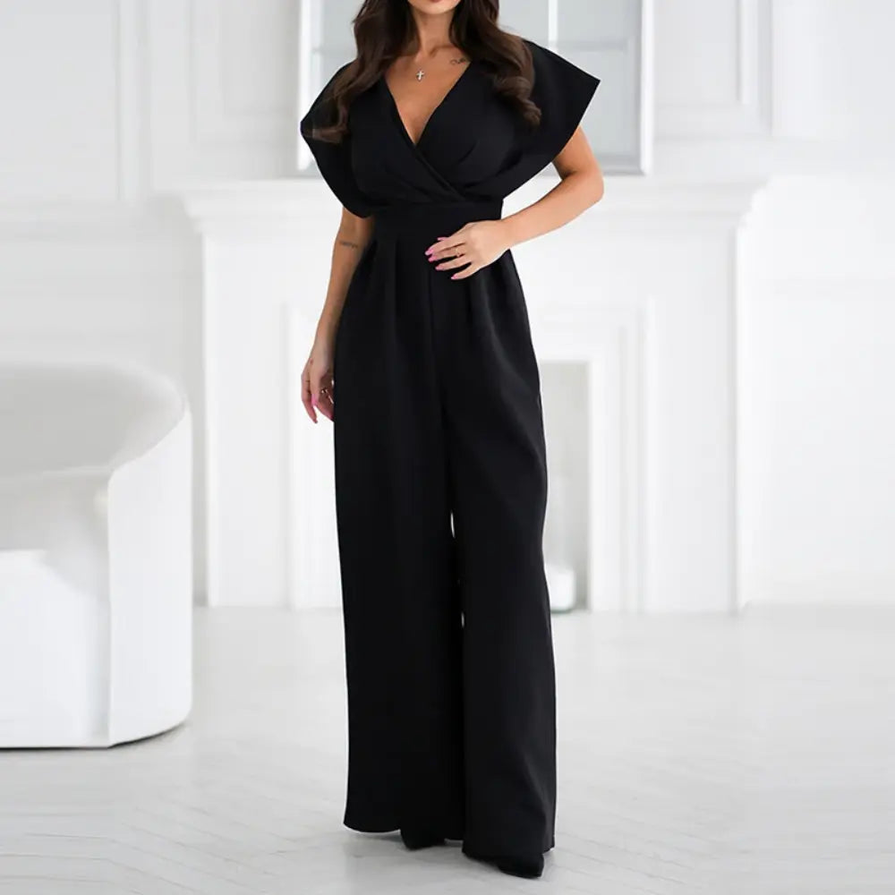 Black wrap jumpsuit with short puffed sleeves and wide-leg pants