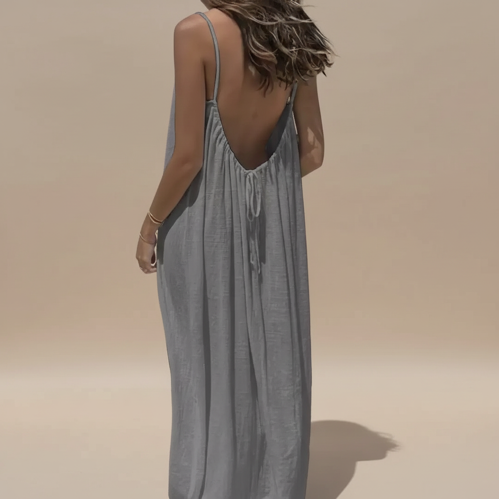 Back view of sage green maxi dress showing low V-back with drawstring and flowing fabric
