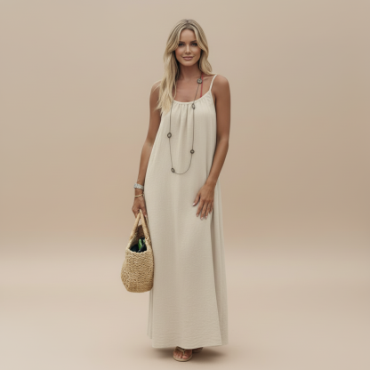 Cream ruched maxi dress with thin straps and layered neckline detail