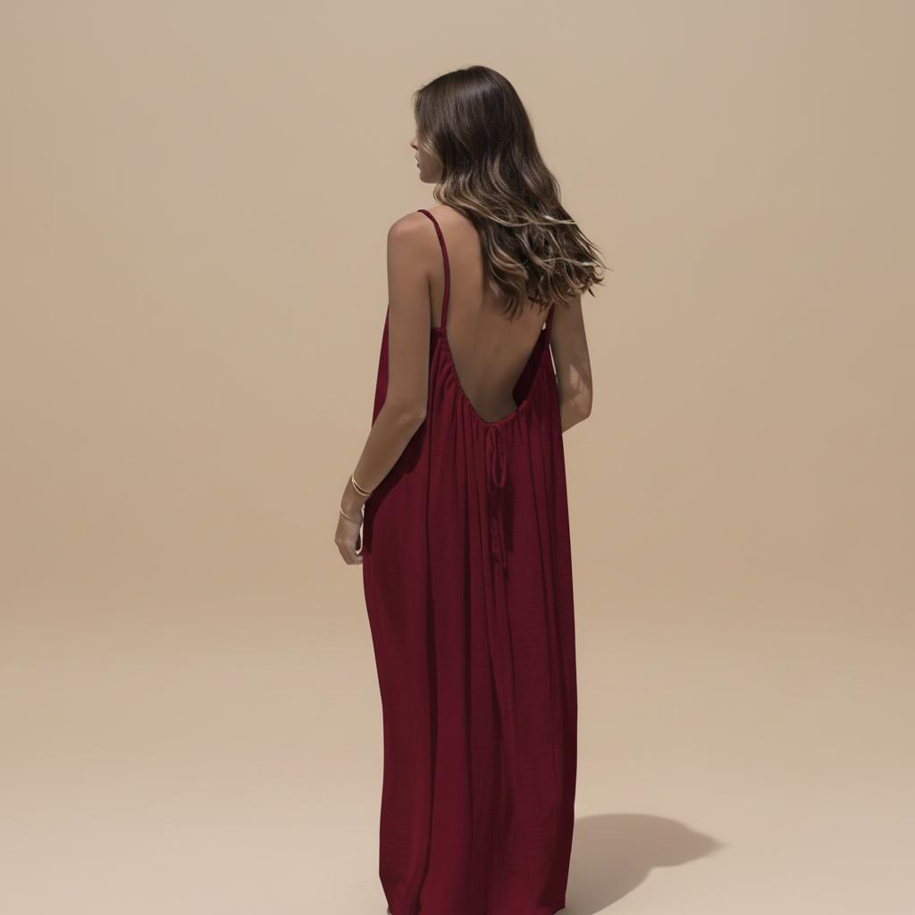 Deep burgundy maxi dress with ruched fabric and low open back view