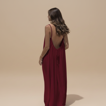 Deep burgundy maxi dress with ruched fabric and low open back view