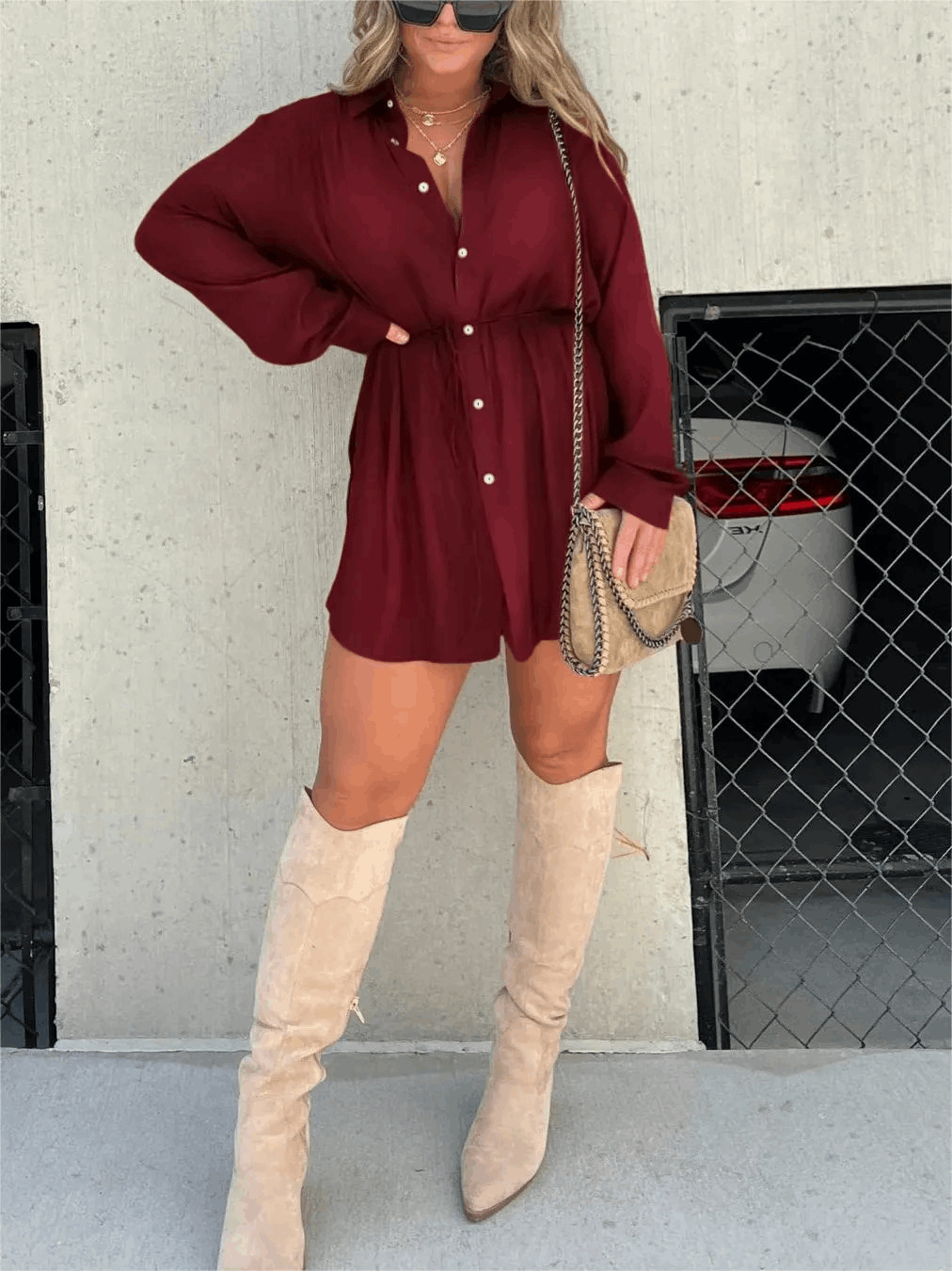 Burgundy button-front mini romper with puffed sleeves and gathered waist