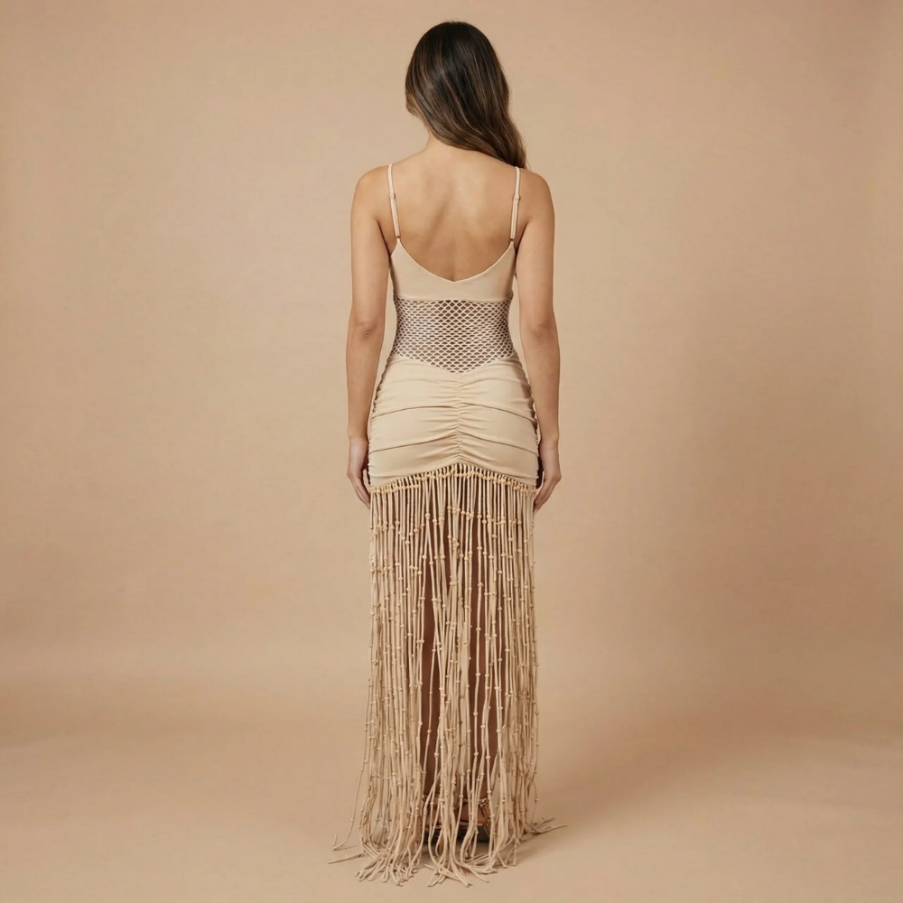 Back view of cream maxi dress showing open back, spaghetti straps, and beaded fringe for women
