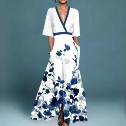 White maxi dress with navy blue floral print, wrap V-neck, and front slit detail