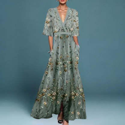 Sage green maxi dress with white and gold floral embroidery, wrap V-neck, and side pockets