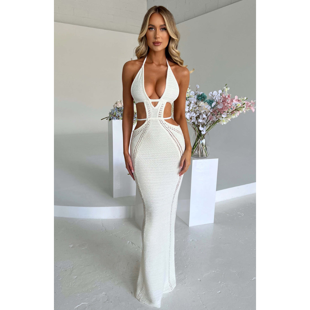 White knit maxi dress with deep V-neckline and waist cutouts