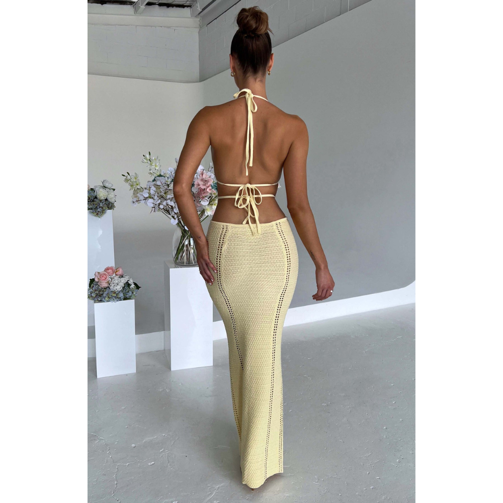 Pale yellow maxi dress back view with tie straps and side cutouts