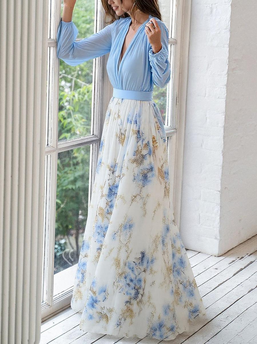Women's floral maxi dress showing flowing botanical print skirt and structured waistband