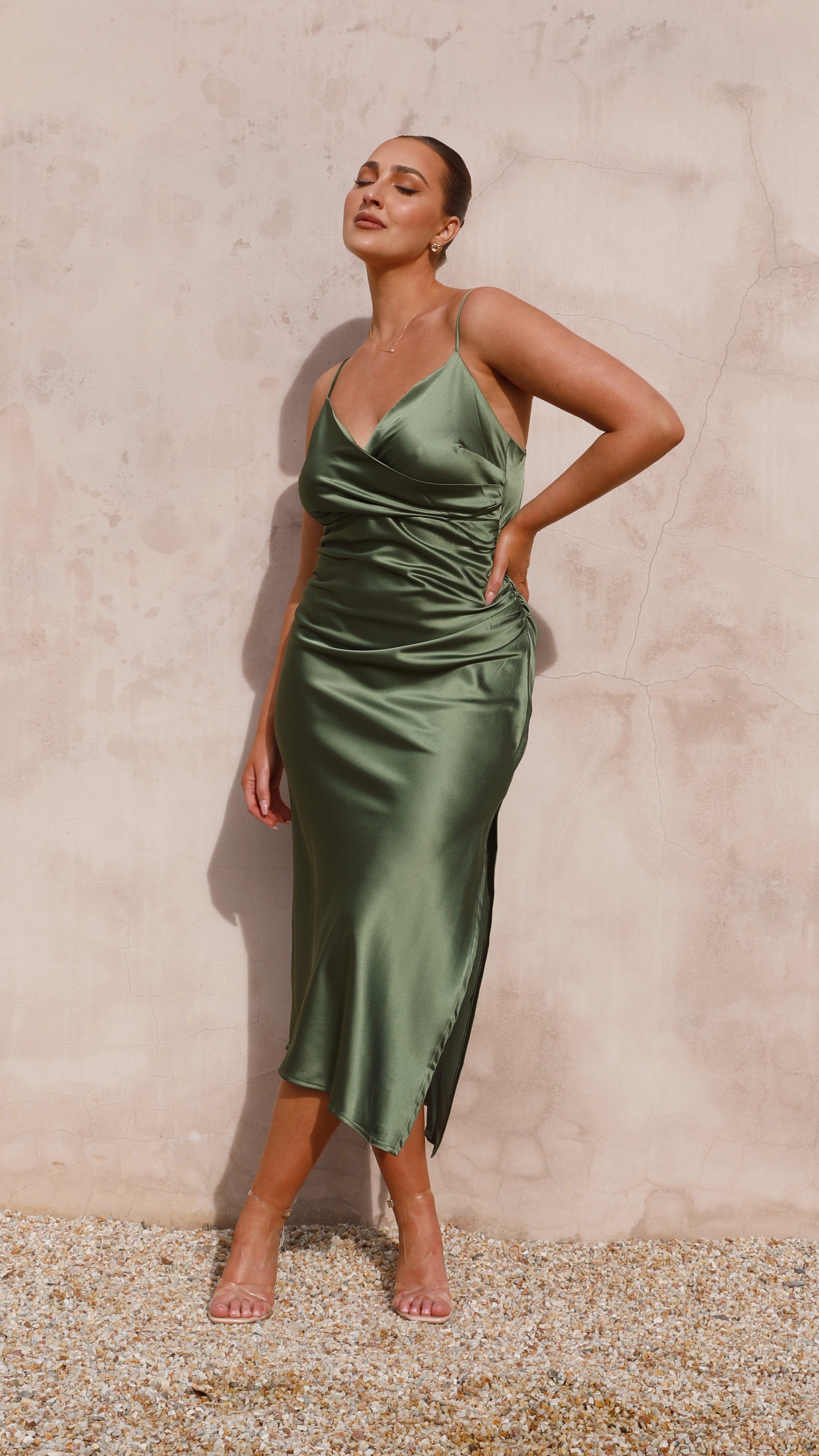 Full-length sage green ruched midi dress with V-neckline and spaghetti straps