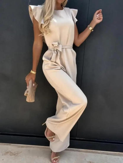 Side angle of cream ruffle jumpsuit with belted waist detail