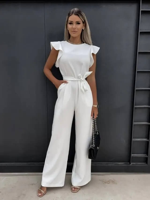 Cream ruffle jumpsuit full length front view with tie waist