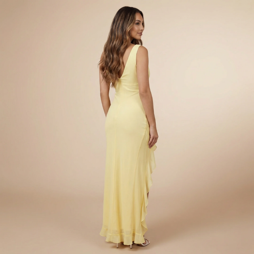 Yellow ruffle maxi dress side view showing high-low asymmetrical hem