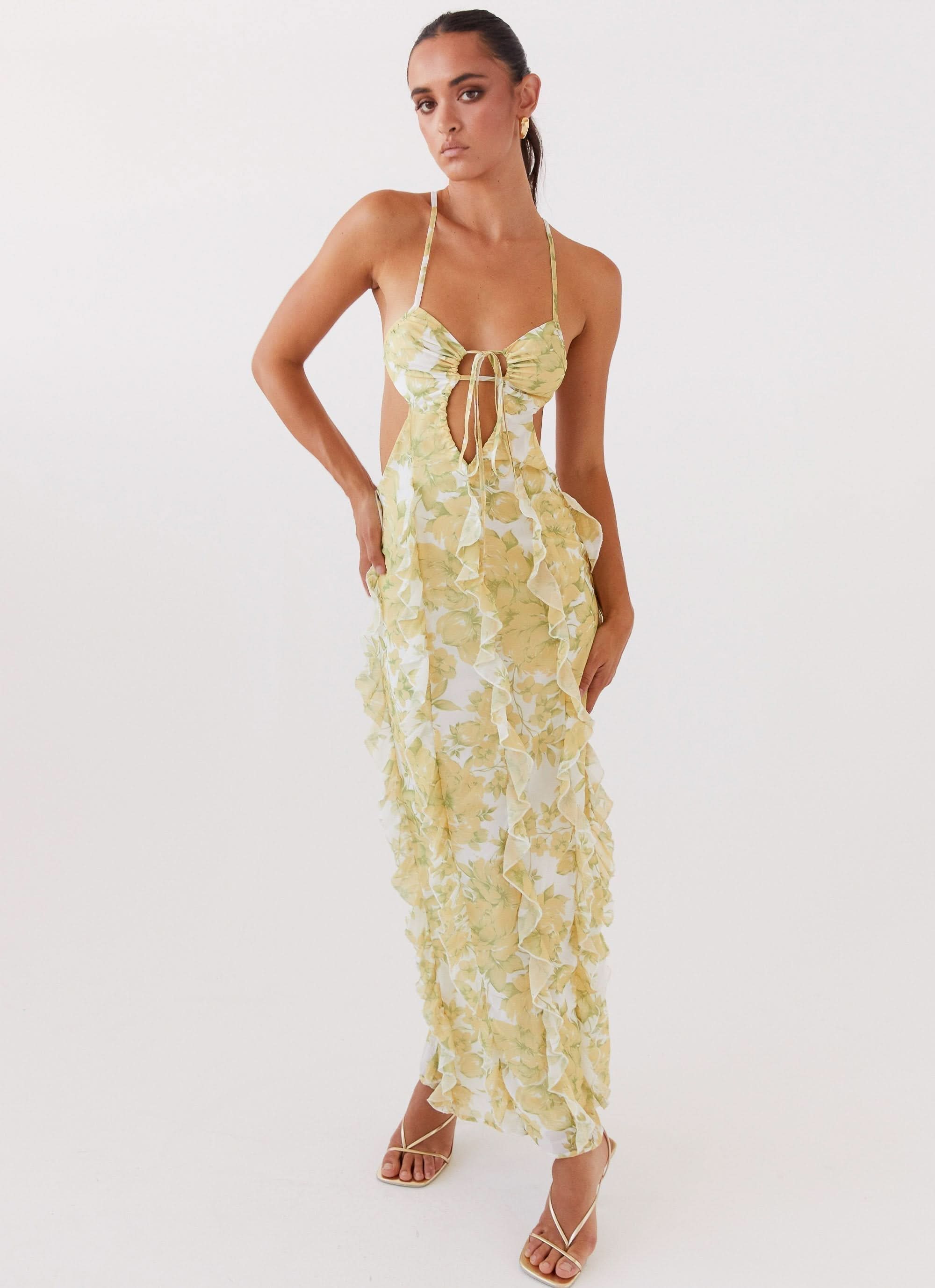 Pale yellow floral halter maxi dress with front tie cutout and ruffle texture for women