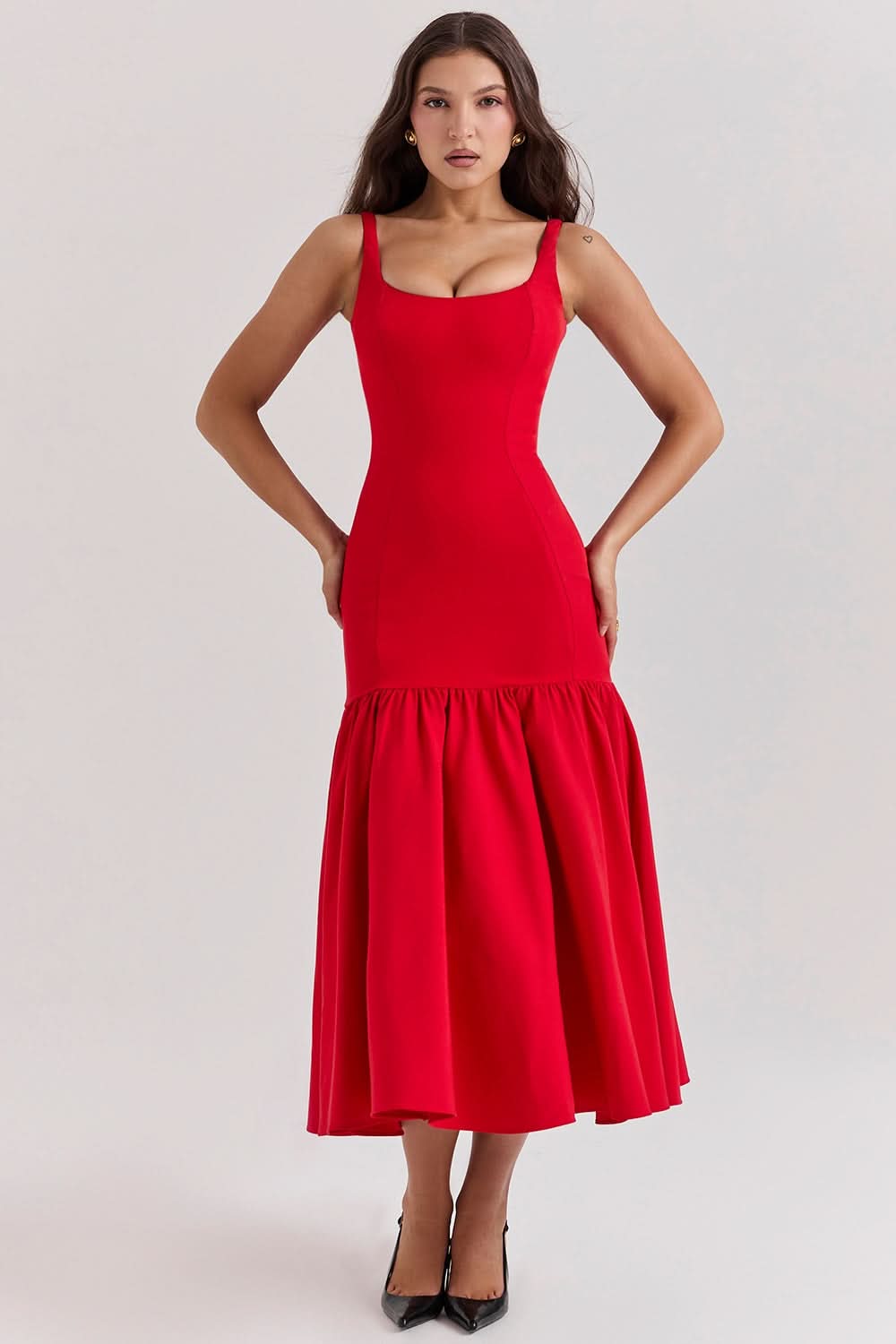 Bright red sleeveless ruffle midi dress with fitted bodice and flared hem