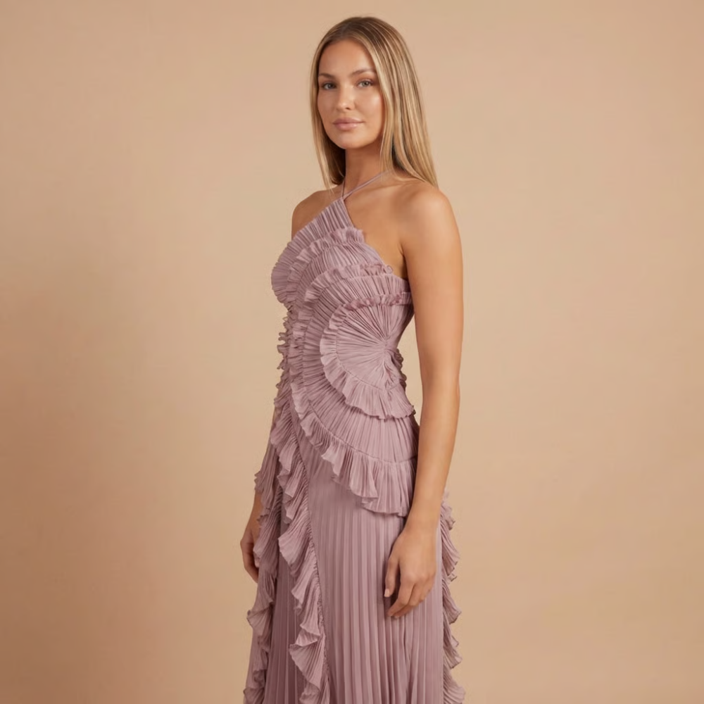 Side view of mauve ruffle midi dress with draped halter neckline