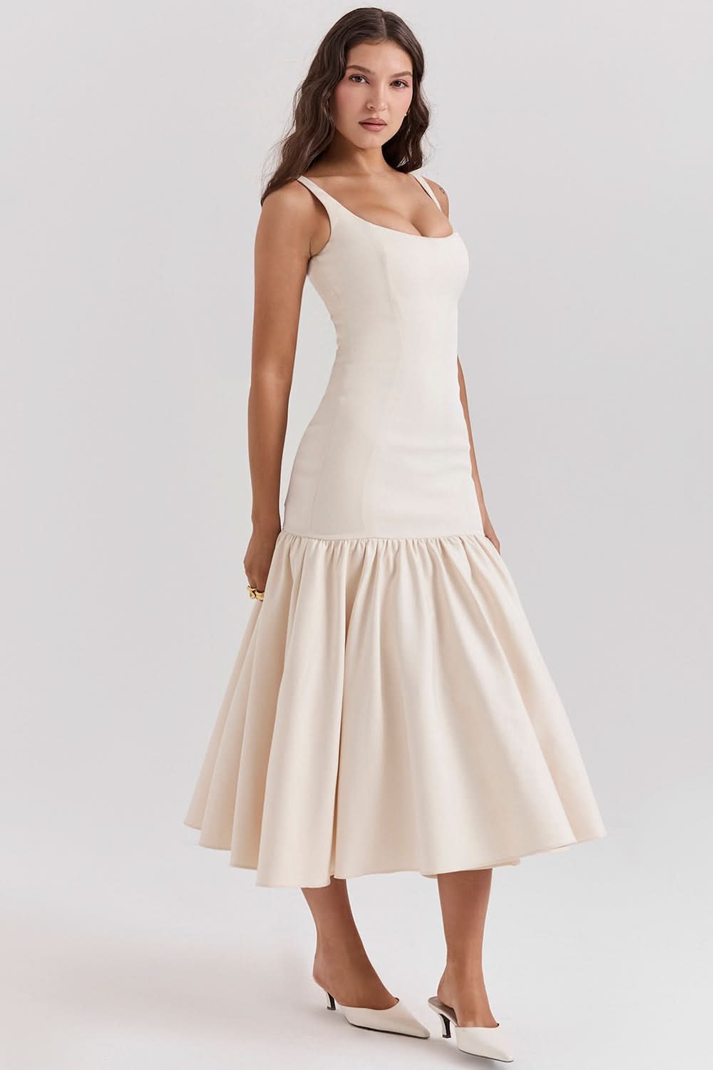 Cream ruffle midi dress back view with open scoop back and voluminous skirt