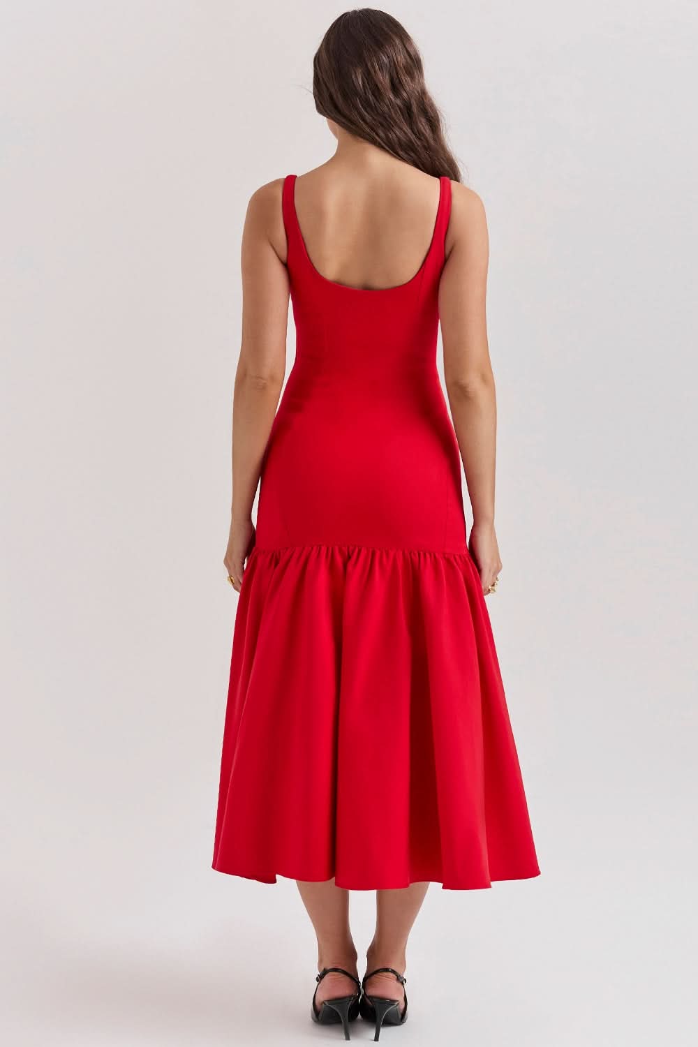 Red ruffle midi dress back view with scoop neckline and voluminous ruffled hem