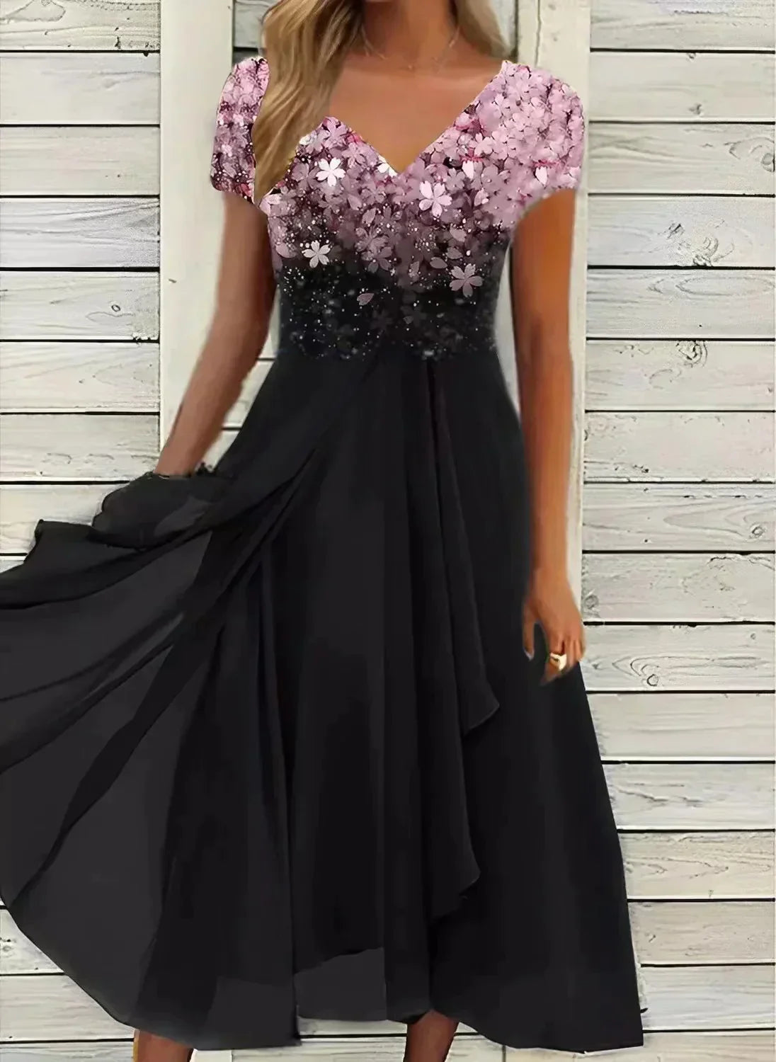 Sequin midi dress featuring mauve floral gradient bodice and black pleated skirt