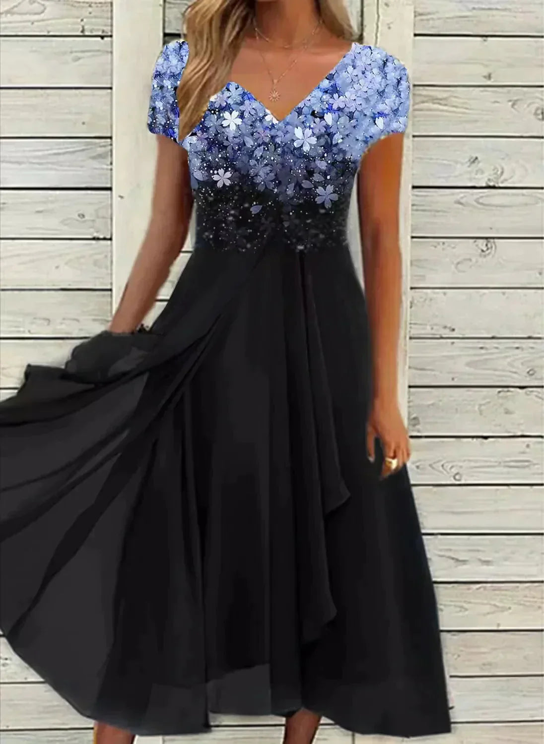 Sequin midi dress with blue floral ombre bodice and black flowing skirt