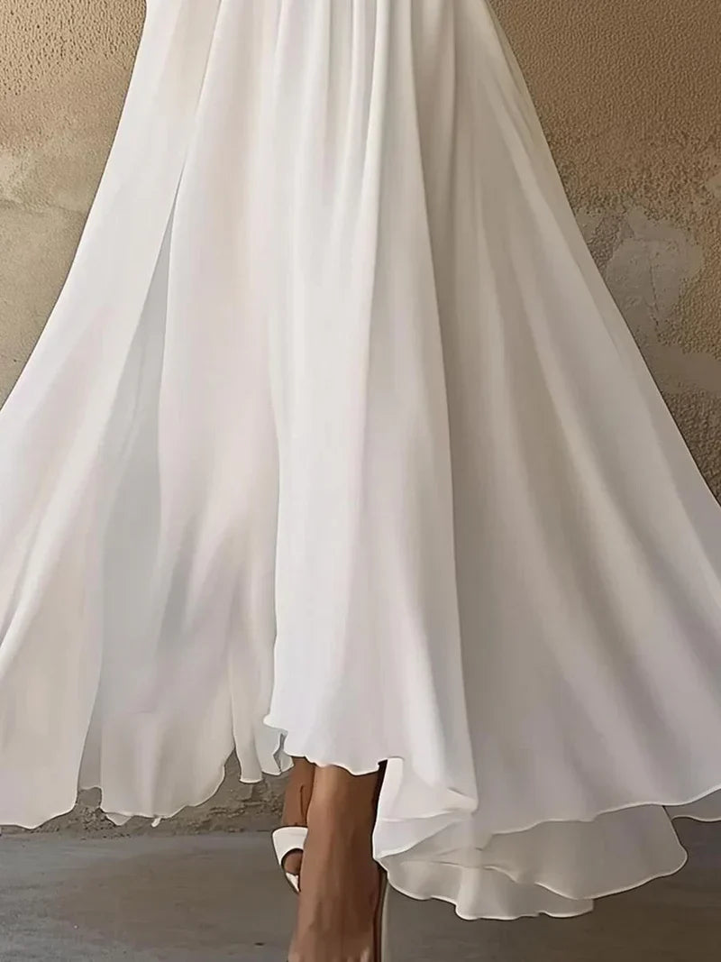 Ivory layered maxi dress hem with asymmetrical flowing layers