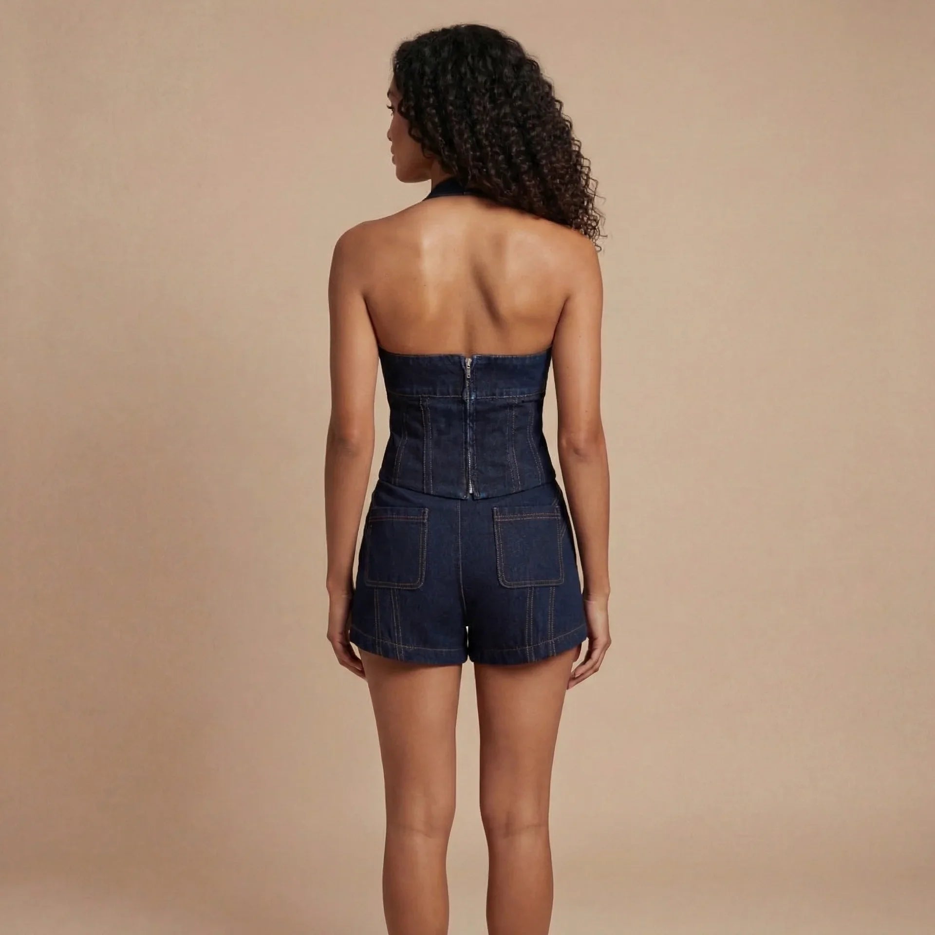 Dark indigo denim corset shorts set back view showing center zipper closure