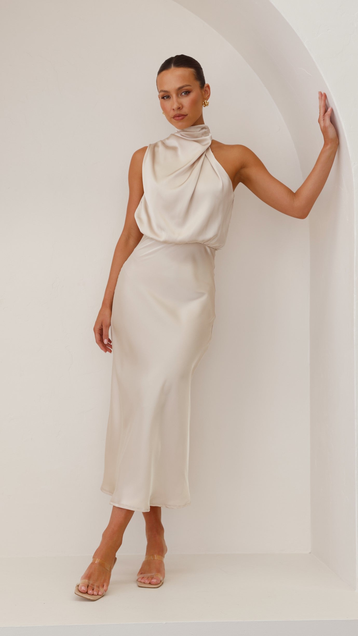 Cream halter midi dress with draped cowl neck and tapered silhouette