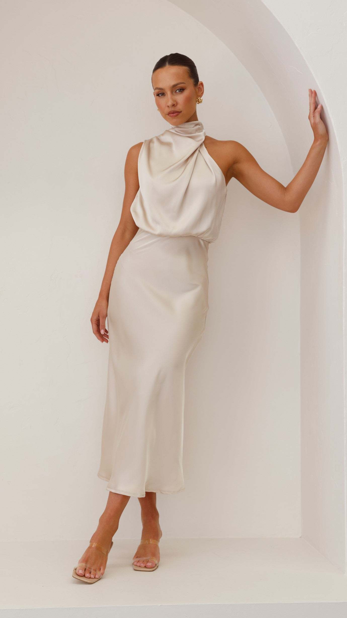 Cream halter midi dress with draped cowl neck and tapered silhouette