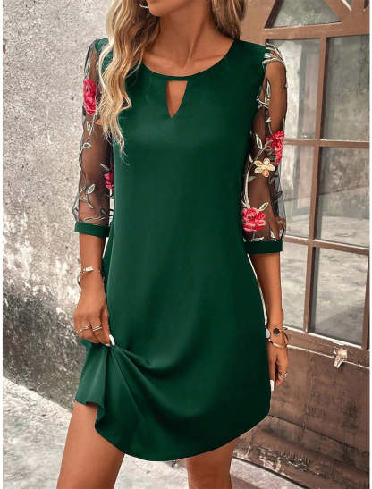 Forest green mini dress featuring sheer floral embroidered 3/4 sleeves and keyhole detail