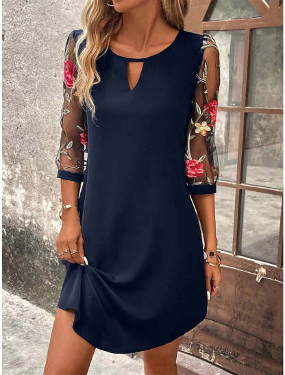 Navy mini shift dress with embroidered mesh sleeves and subtle keyhole cutout neckline