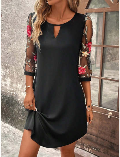 Black mini dress with sheer floral embroidered sleeves and refined keyhole neckline