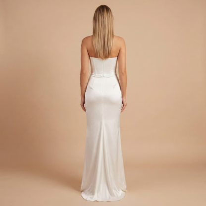 Back view of white strapless ruched maxi dress showing center seam