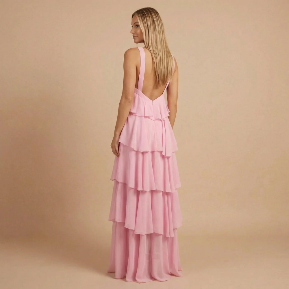 Back view of pink ruffle maxi dress with open back detail