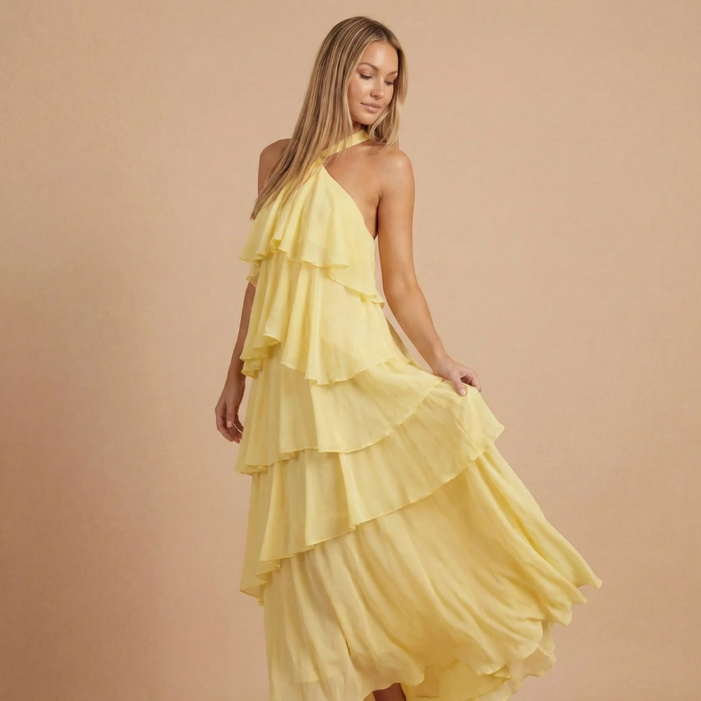 Yellow halter ruffle maxi dress with flowing tiered skirt