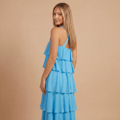 Back view of blue ruffle maxi dress showing open back straps