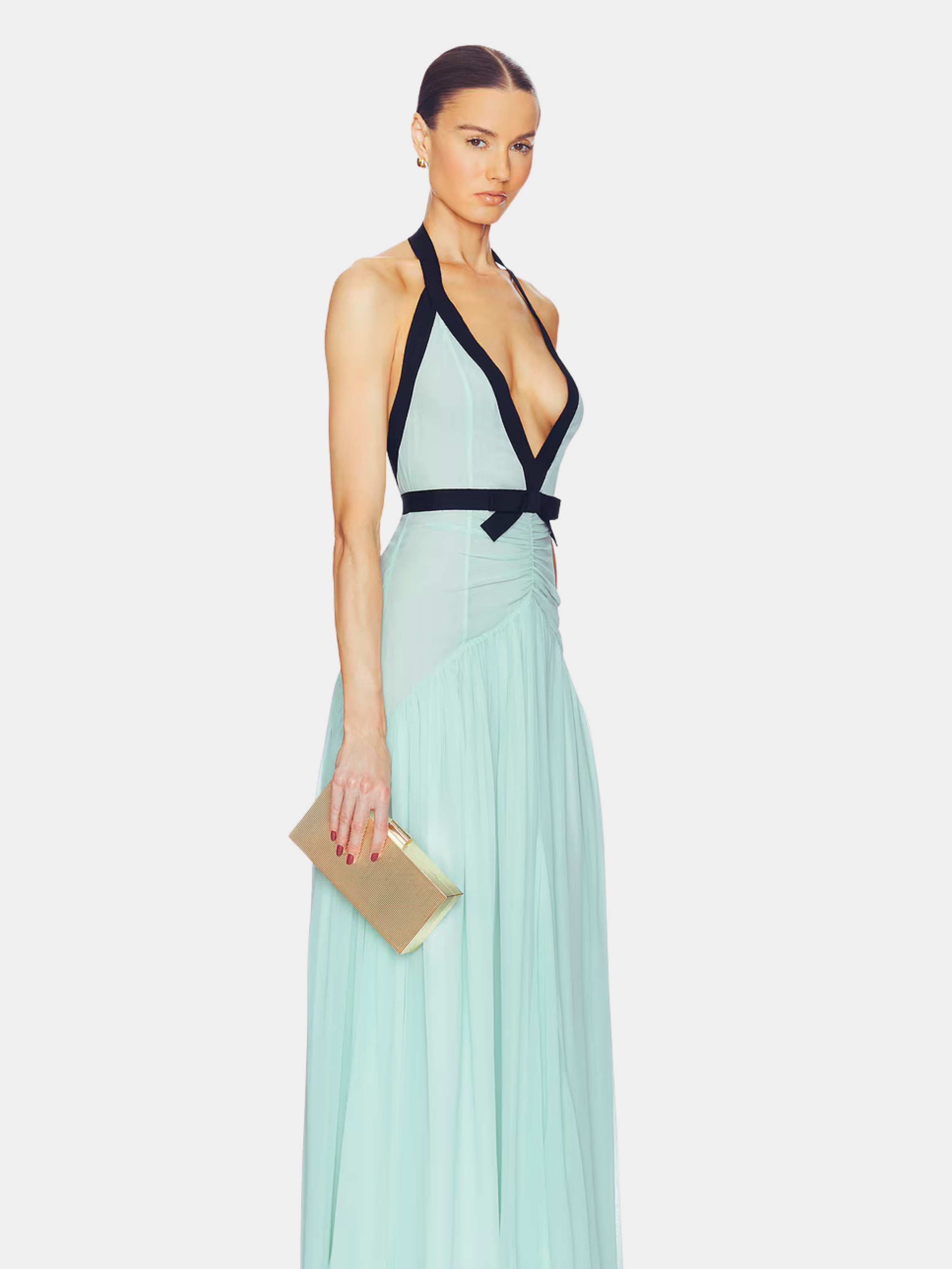 Side view of mint backless maxi dress with black halter straps