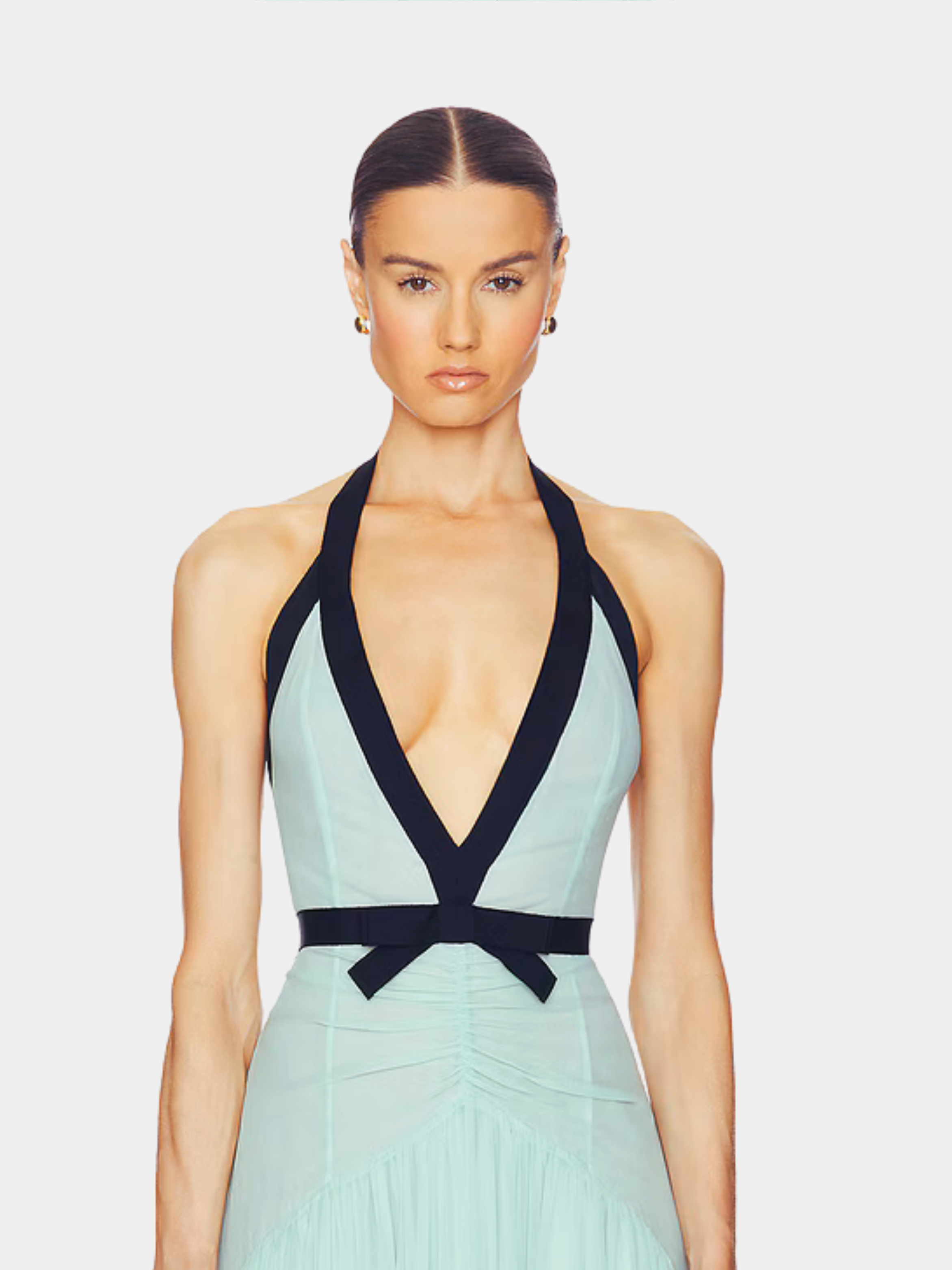 Close-up front of mint dress with deep V-neckline and black bow detail