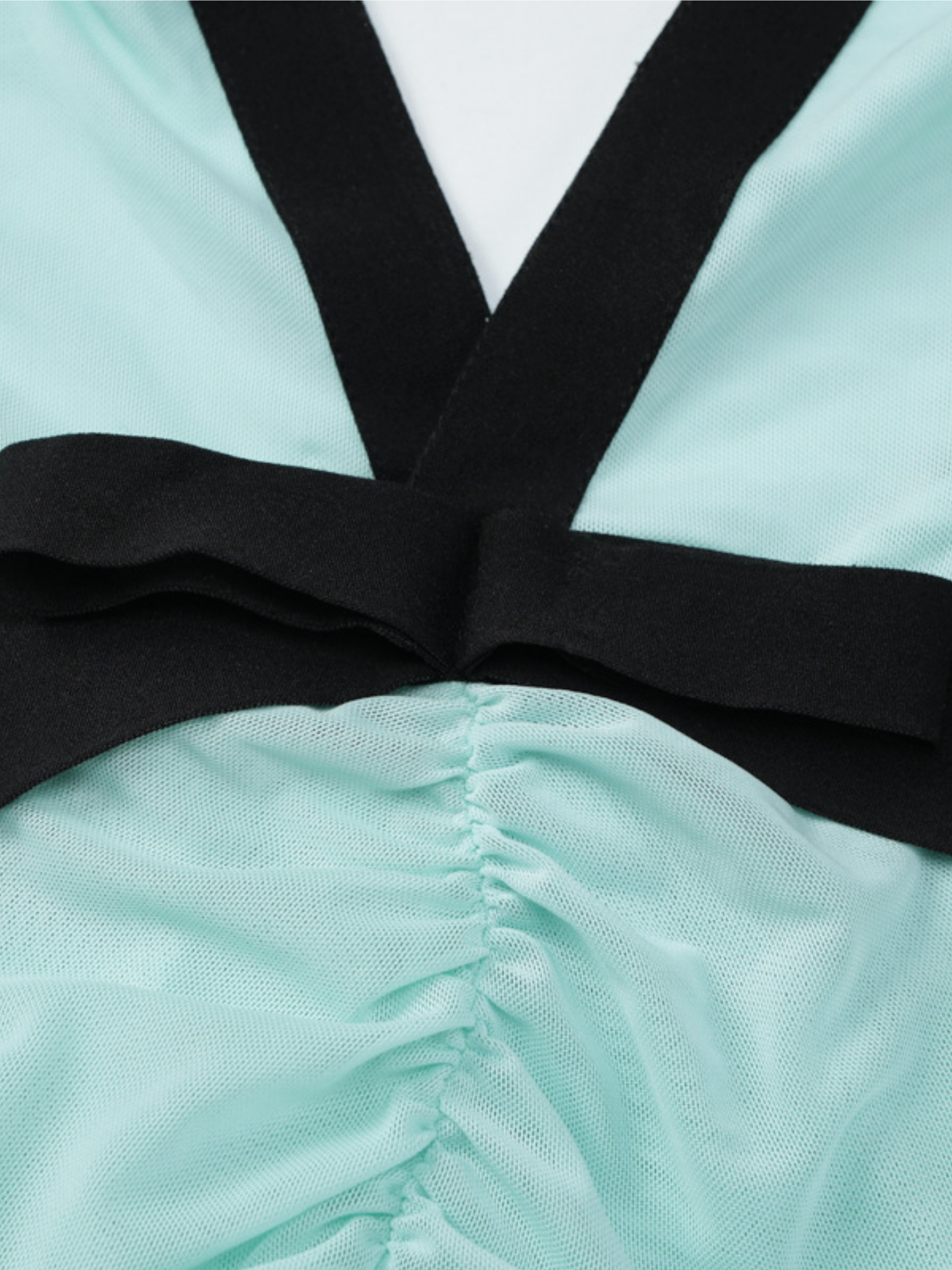 Black bow waist detail with mint pleated skirt on backless dress