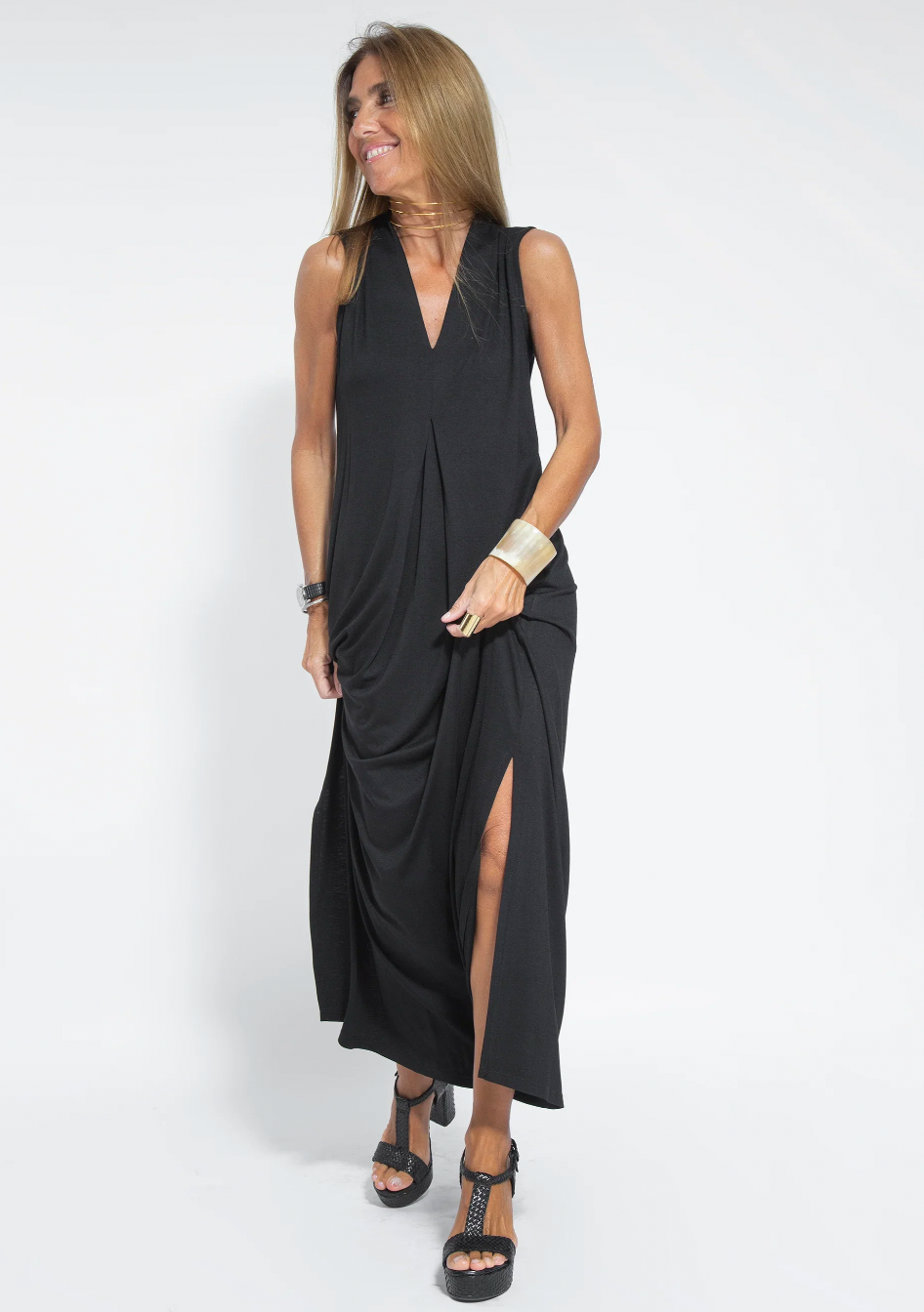 Black sleeveless draped maxi dress with deep V-neckline