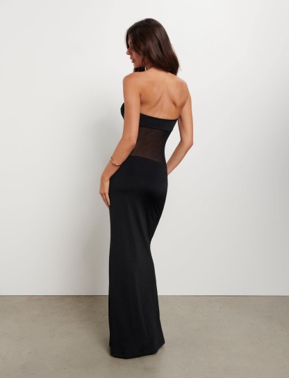 Back view of black maxi dress with strapless cut and sheer mesh panel